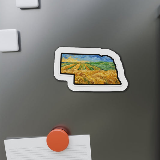 Fridge magnet shaped like a stylized map of Nebraska on a refrigerator.