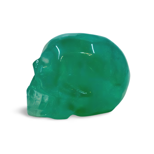 Green skull-shaped object on a white background