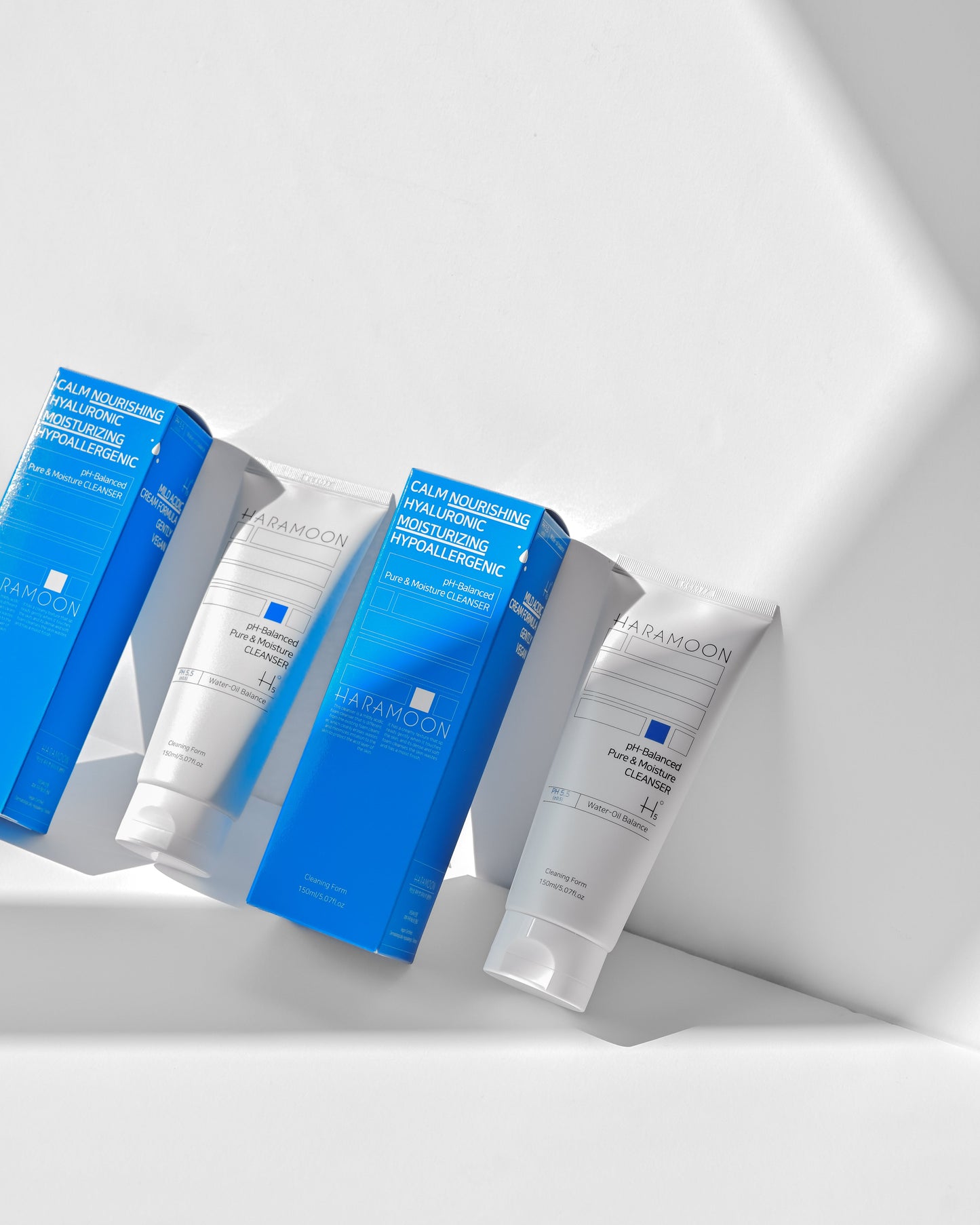 Tube of HARAMOON Pure Moisture Cleanser with water droplets on surface