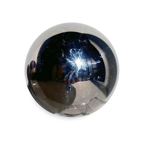 Polished Terahertz crystal sphere with a smooth metallic sheen displayed as a collector's piece — Wax | Wane crystal editorial