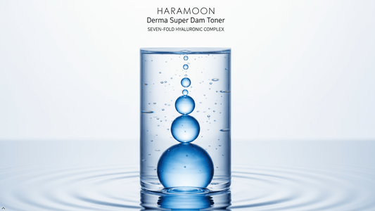 Flat lay of a minimalist hyaluronic acid toner bottle on a clean surface with soft botanical accents — HARAMOON gentle skincare editorial