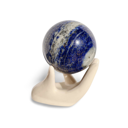 Solid gemstone ball in rich blue with natural white calcite veins and metallic gold pyrite sparkles, viewed from the side.