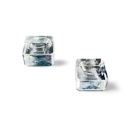 Crystal-clear acrylic glass stand with concave center, displayed on white background.