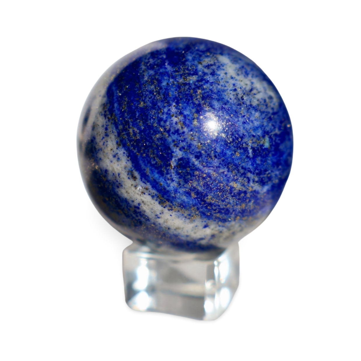 Macro shot of pyrite flecks and calcite striations in a polished lapis lazuli sphere.