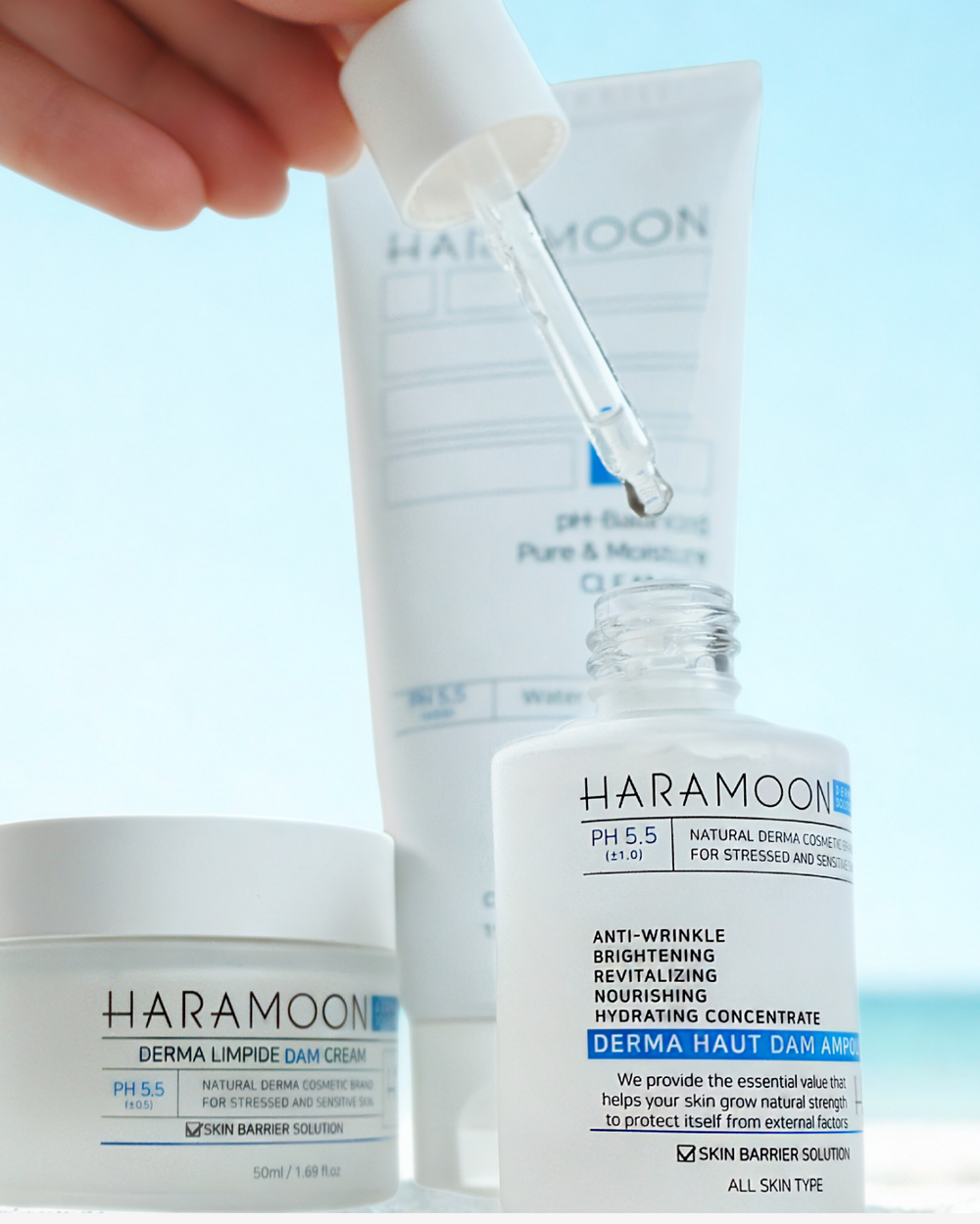 Haramoon skincare products with a dropper on a blue background