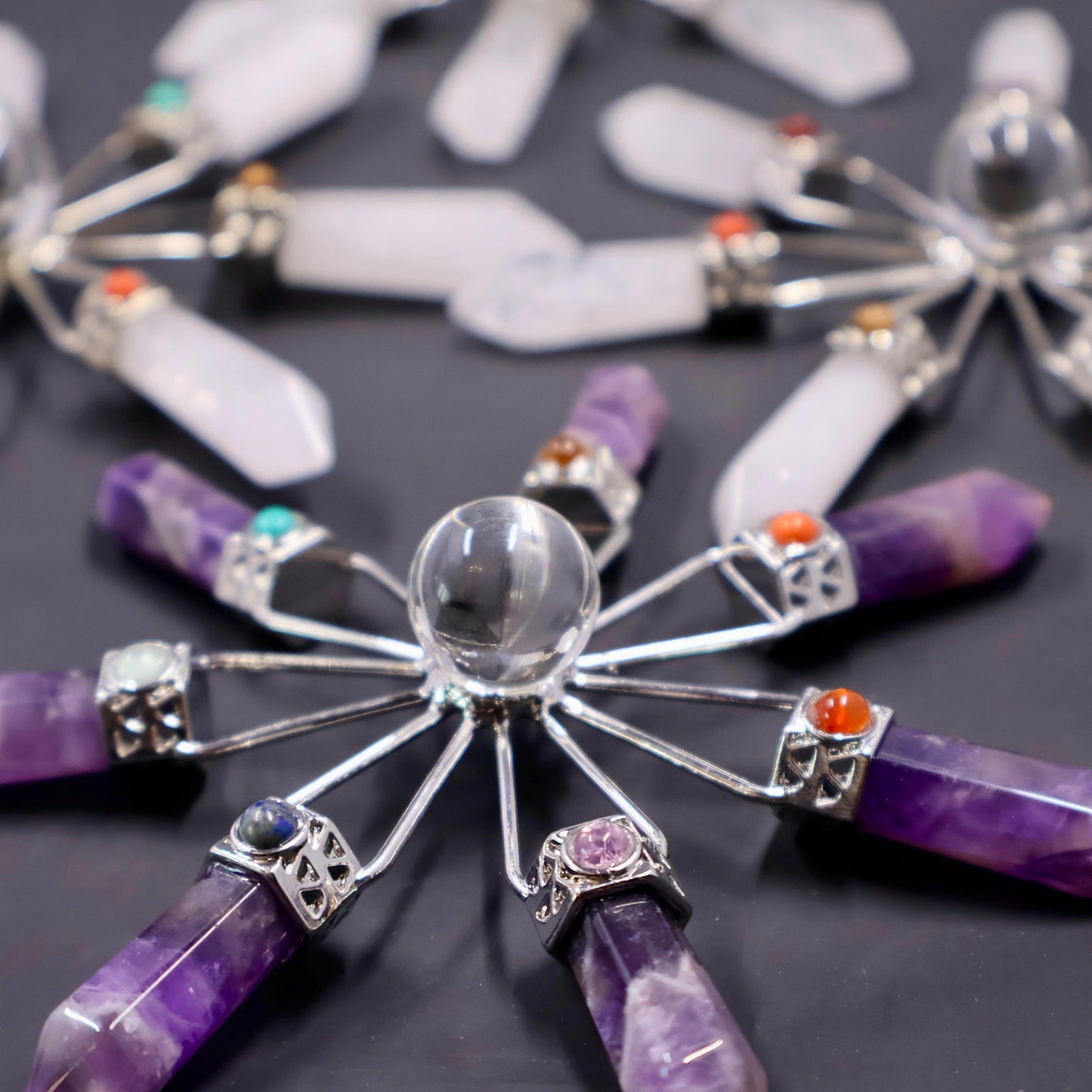 Amethyst crystal window suncatcher with geometric gold frame, catching sunlight