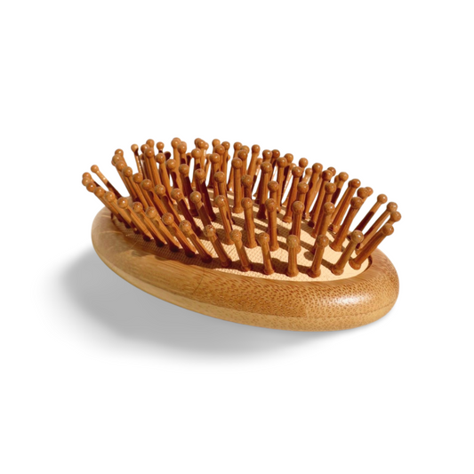 Eco-friendly handheld brush featuring a smooth bamboo base and rounded wooden bristles for comfortable hair brushing.