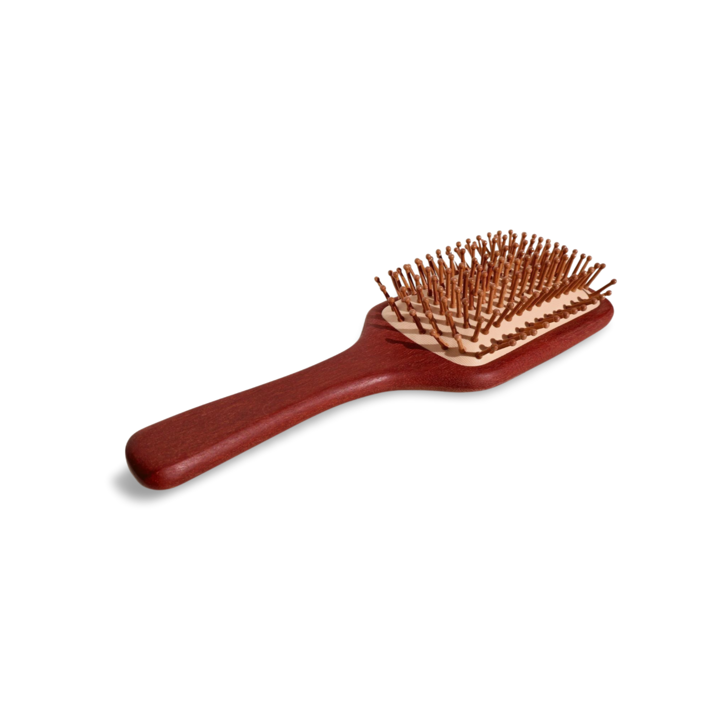 Extra-large wooden paddle hair brush with rounded ball-tip bristles, made from red sandalwood.