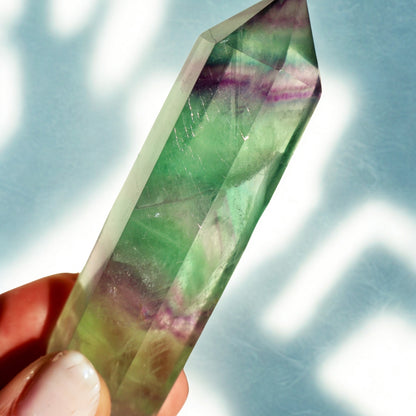 unique Fluorite Obelisk in Green and Purple in macro texture