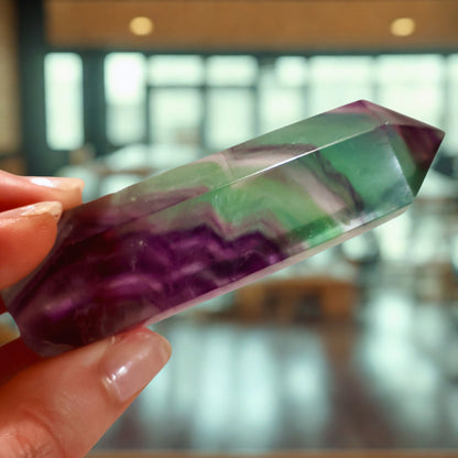 shiny Fluorite Obelisk in Green and Purple in handheld perspective