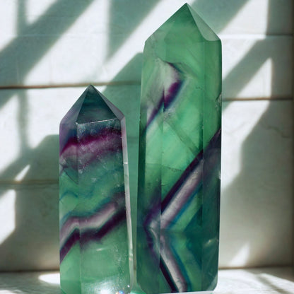 natural Fluorite Obelisk in Green and Purple in macro texture