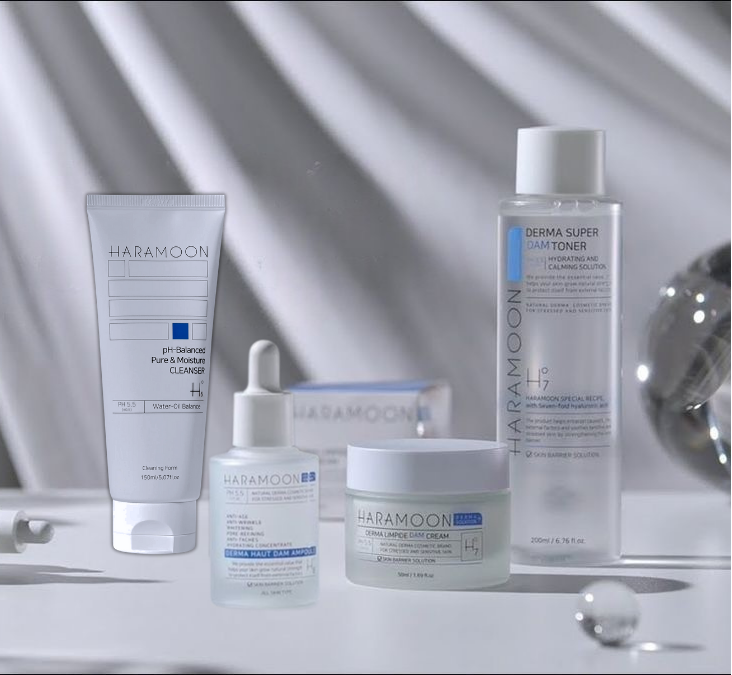 Collection of Haramoon skincare products on a reflective surface with a neutral background