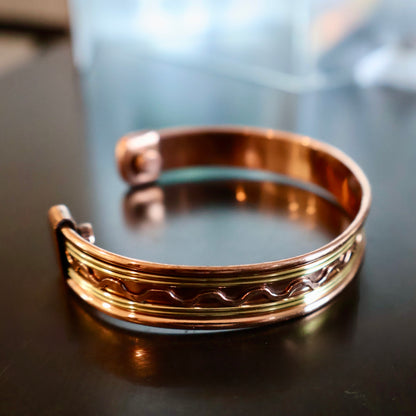 carved Copper Cuff Bracelet, Pure Copper with Two-Tone Brass Wave Design and 2 Magnets, Stress Relief in displayed on surface