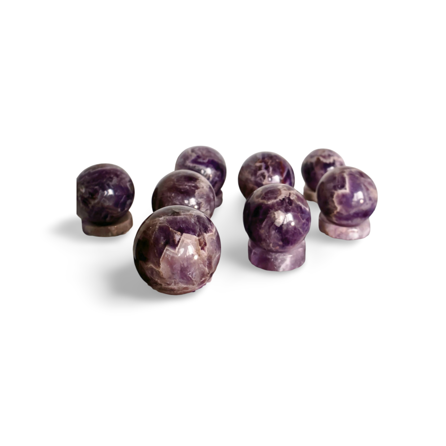 Purple crystal balls on a white background