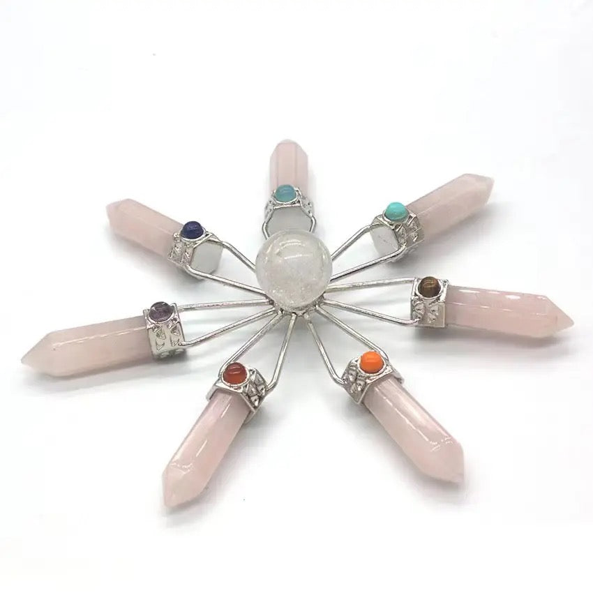 Rose quartz ornament refletions on white wall