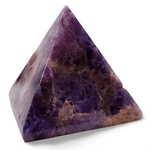 Triangular purple stone on a white background