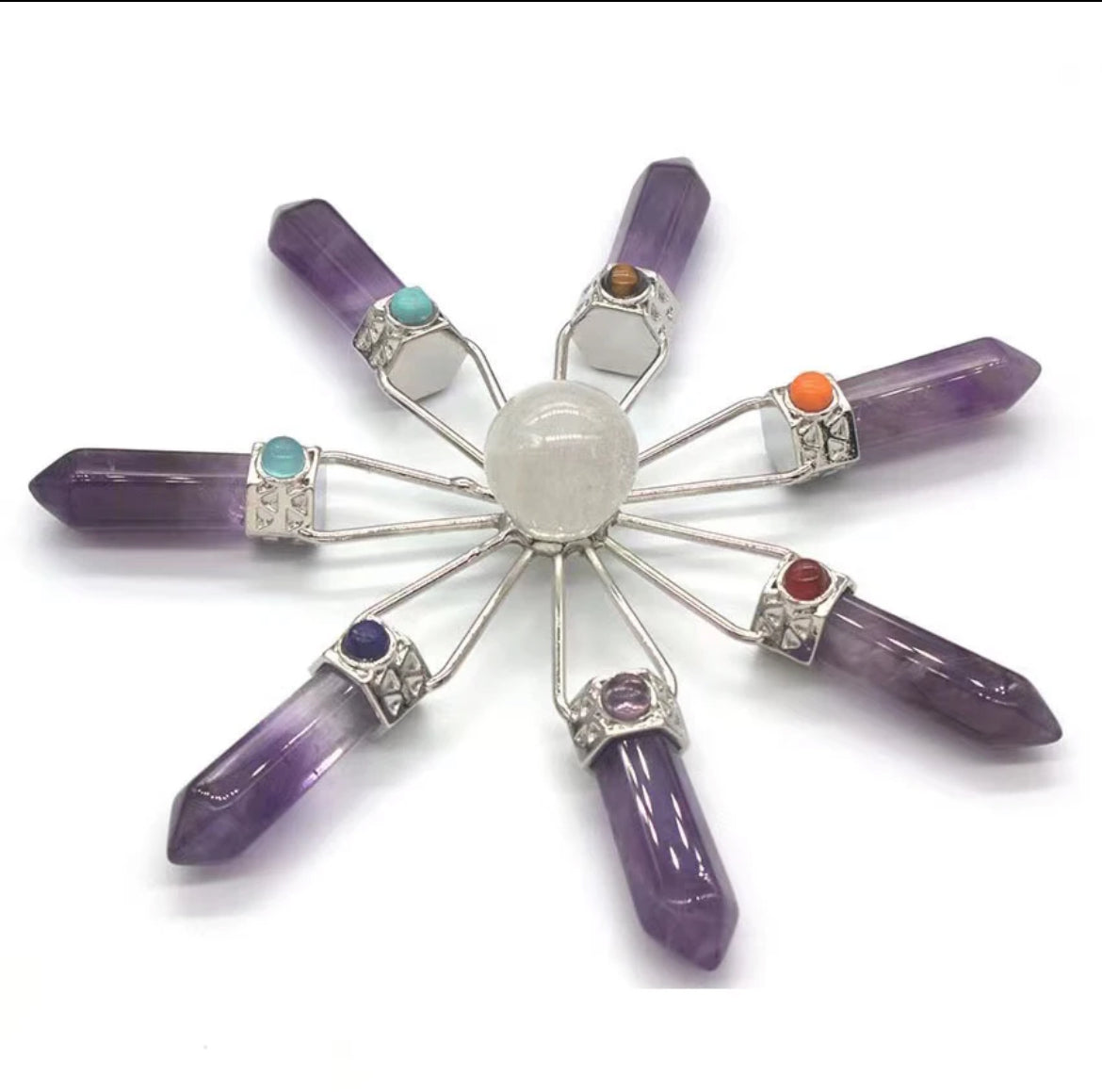 Amethyst, Clear & Rose Quartz Suncatcher on surface