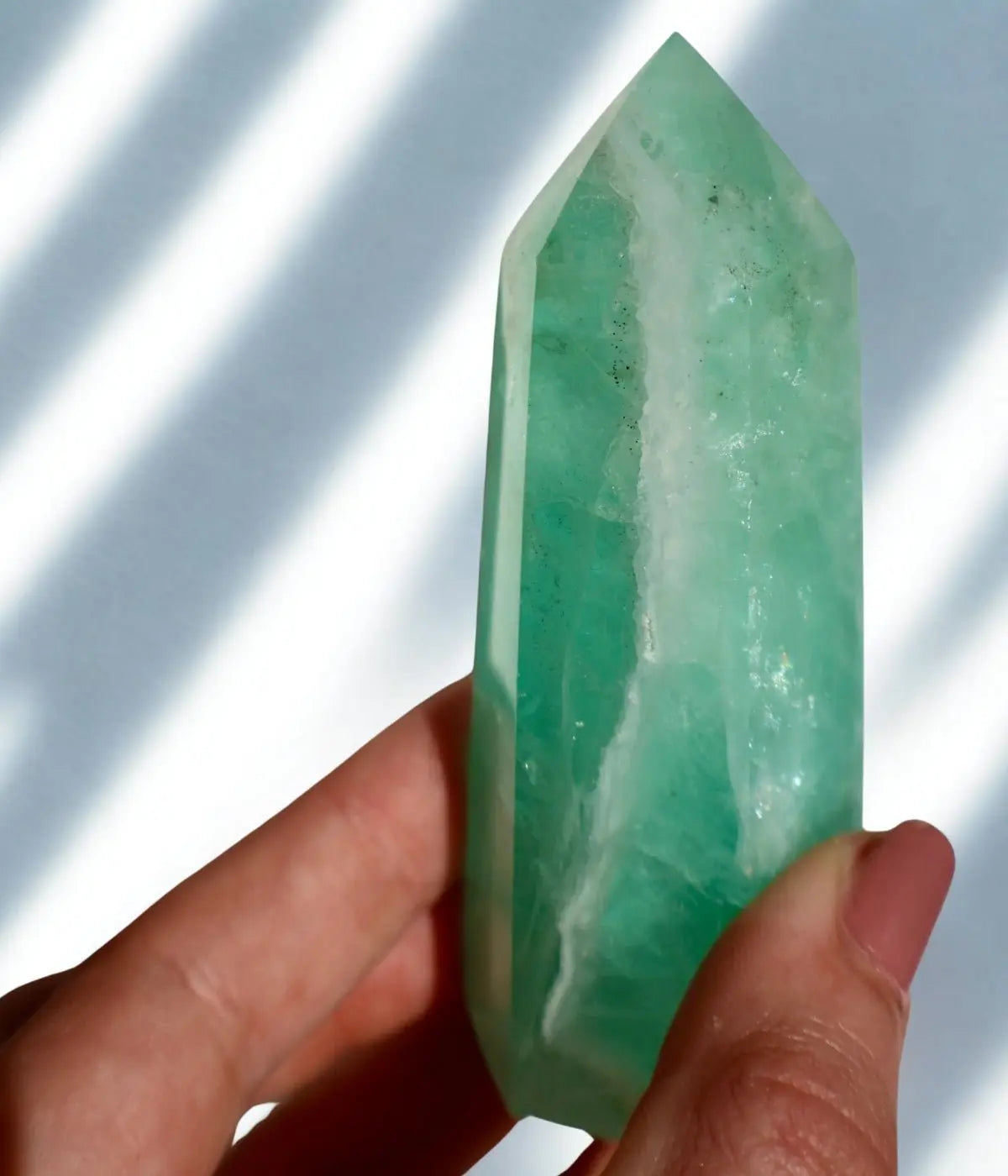 glimmering Fluorite Obelisk, Icey Seafoam Green Crystal 3-4" in lighting effect