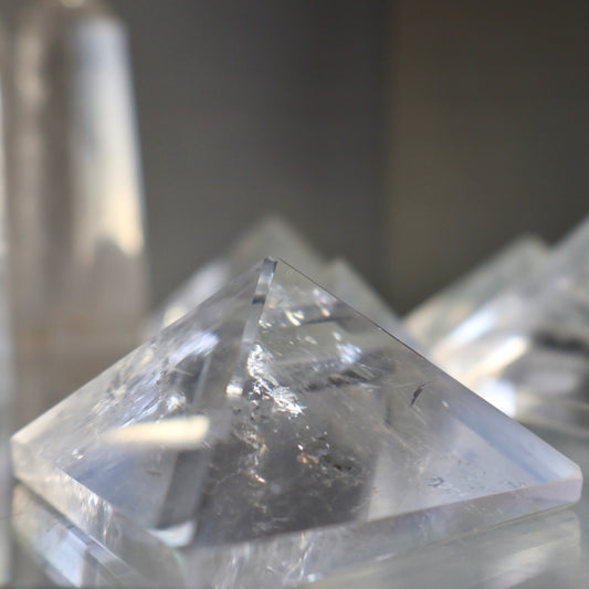 natural Clear Quartz Pyramid in studio background
