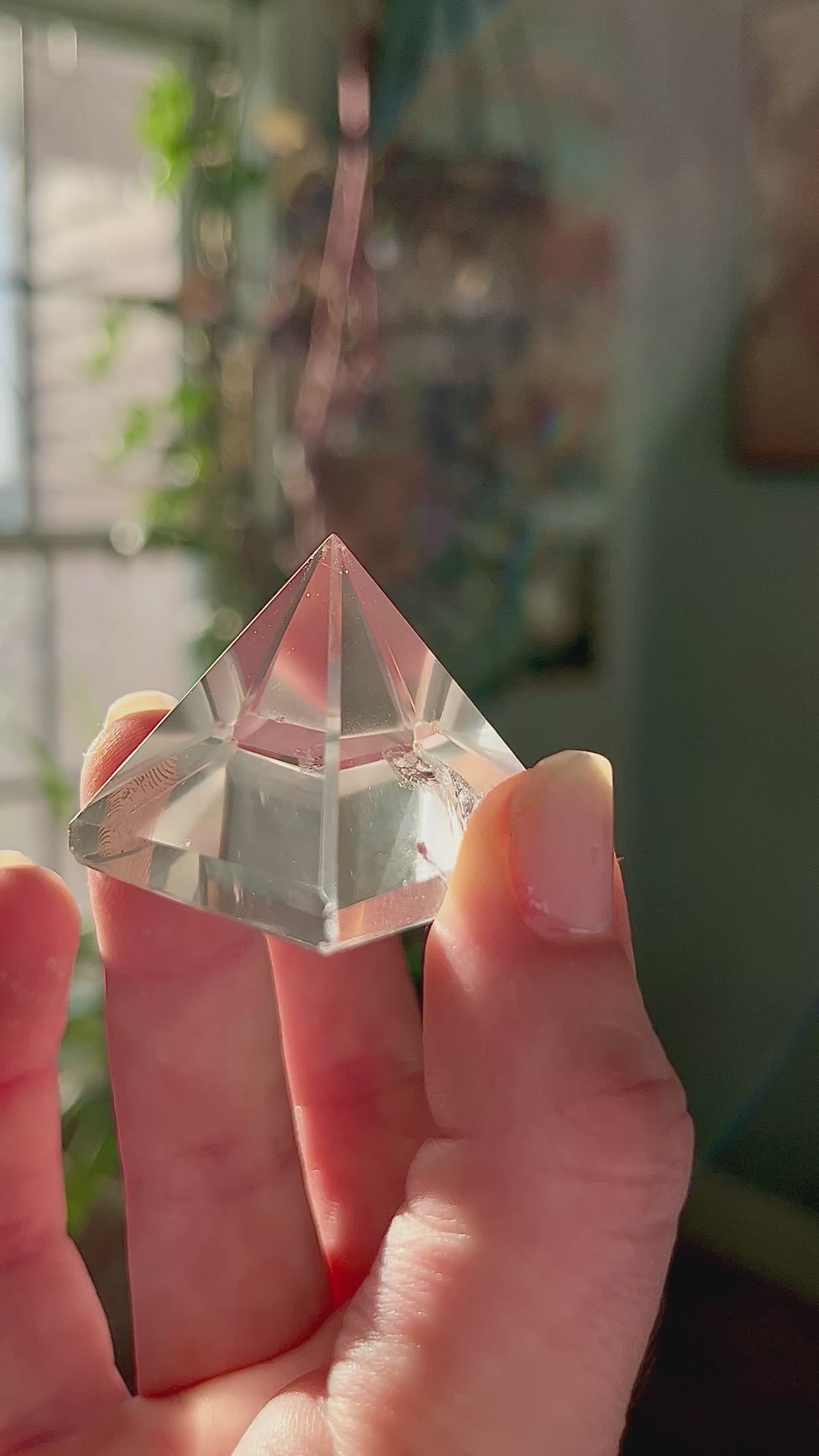 crystal pyramid close-up with light reflections on polished surfaces